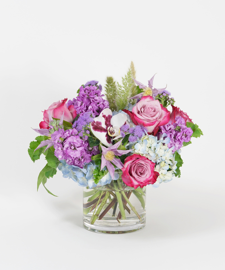 purple, lavender, and blue floral design with roses, hydrangea, and orchids