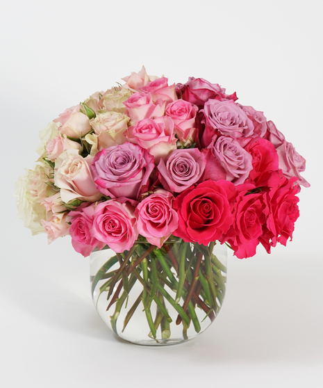 luxury ombre design of all white, pink and red roses.