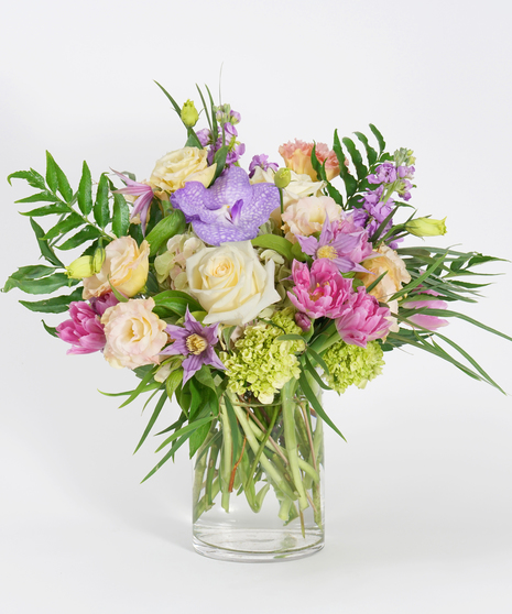 gardeny floral design of buttercream roses, lavender tulips and pink hydrangea