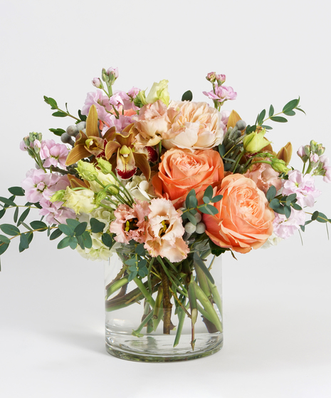 white hydrangea, peach roses and bronze orchids with fall foliage accents
