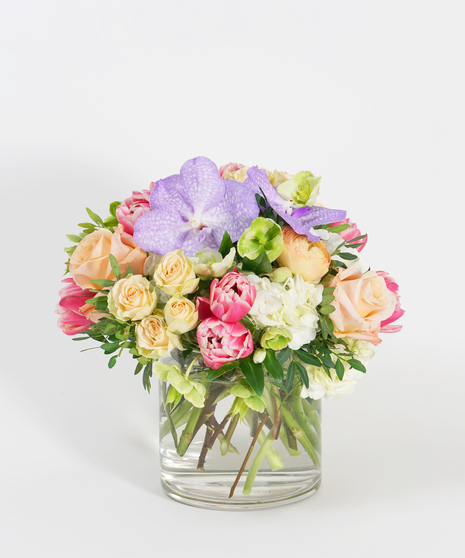pastel lavender, pink, peach and white flower arrangement with roses, hydrangea, and tulips