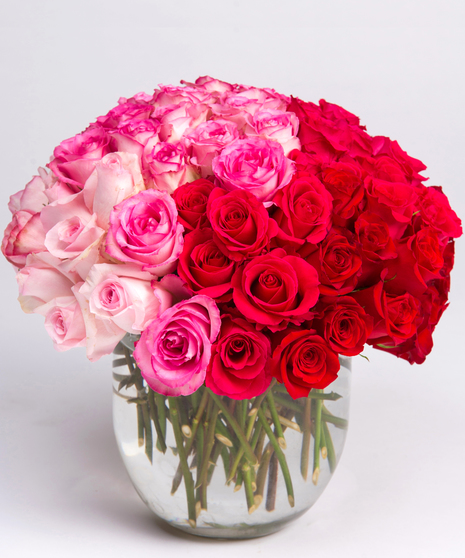 luxury ombre design of all white, pink and red roses.