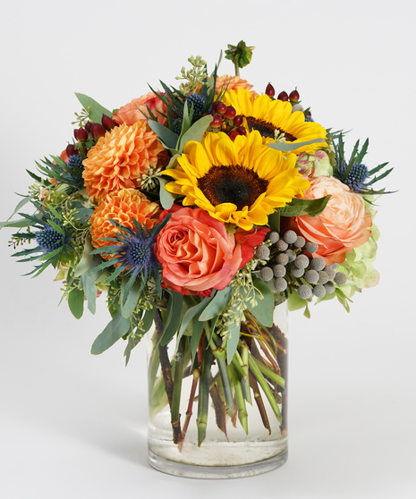 sunflower, orange roses and dahlias accented with fall greens