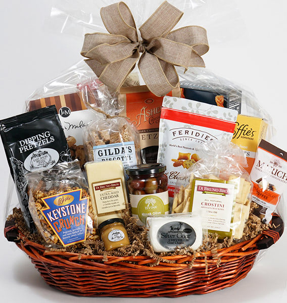 A wide variety of individually-packaged snacks in a round gift basket